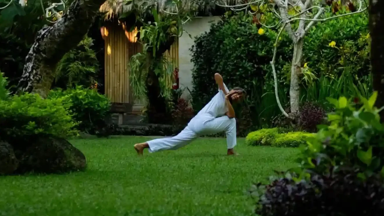 Morning yoga in a retreat garden, Ubud